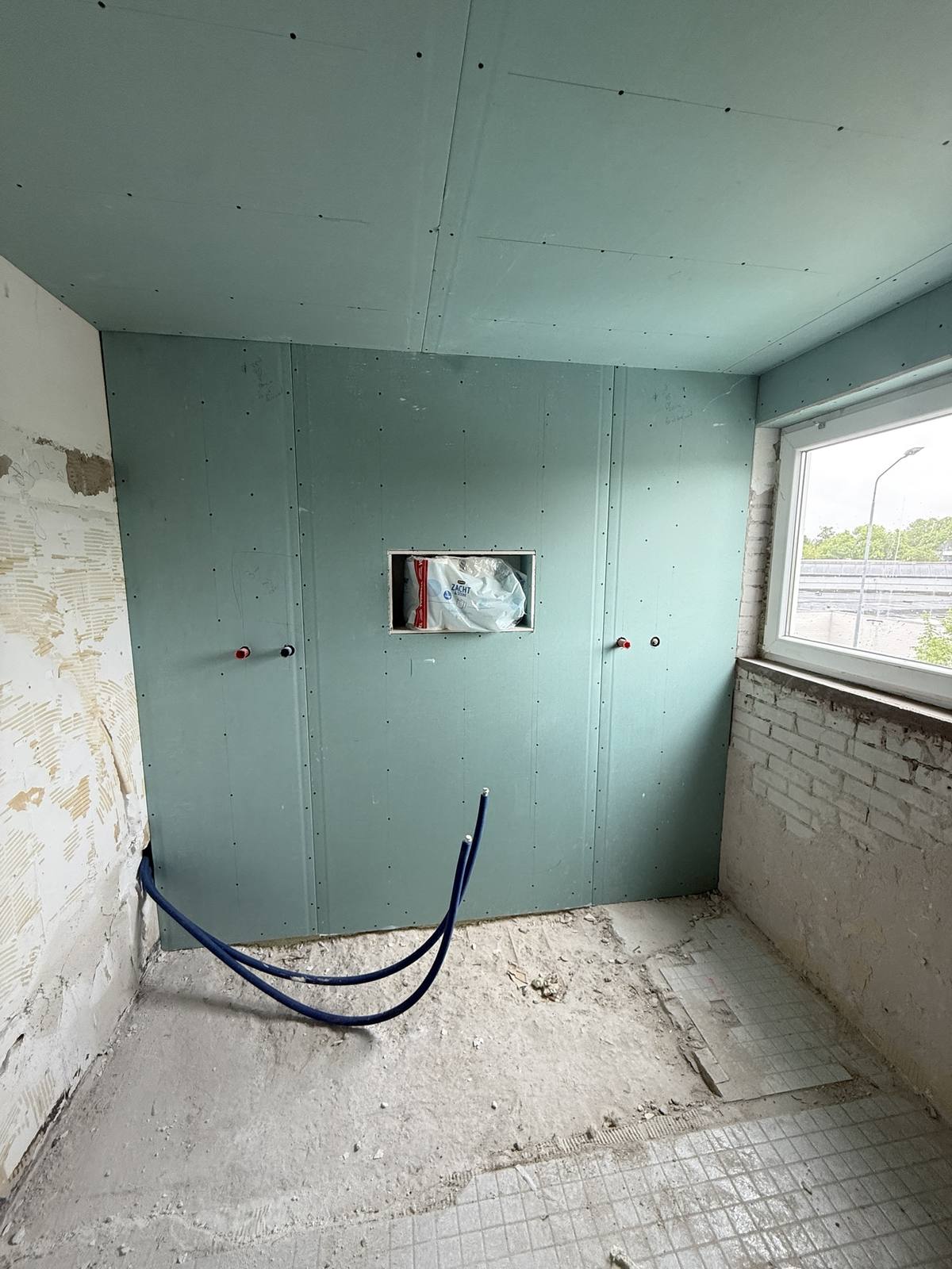 Badkamer met groene gipsplaten